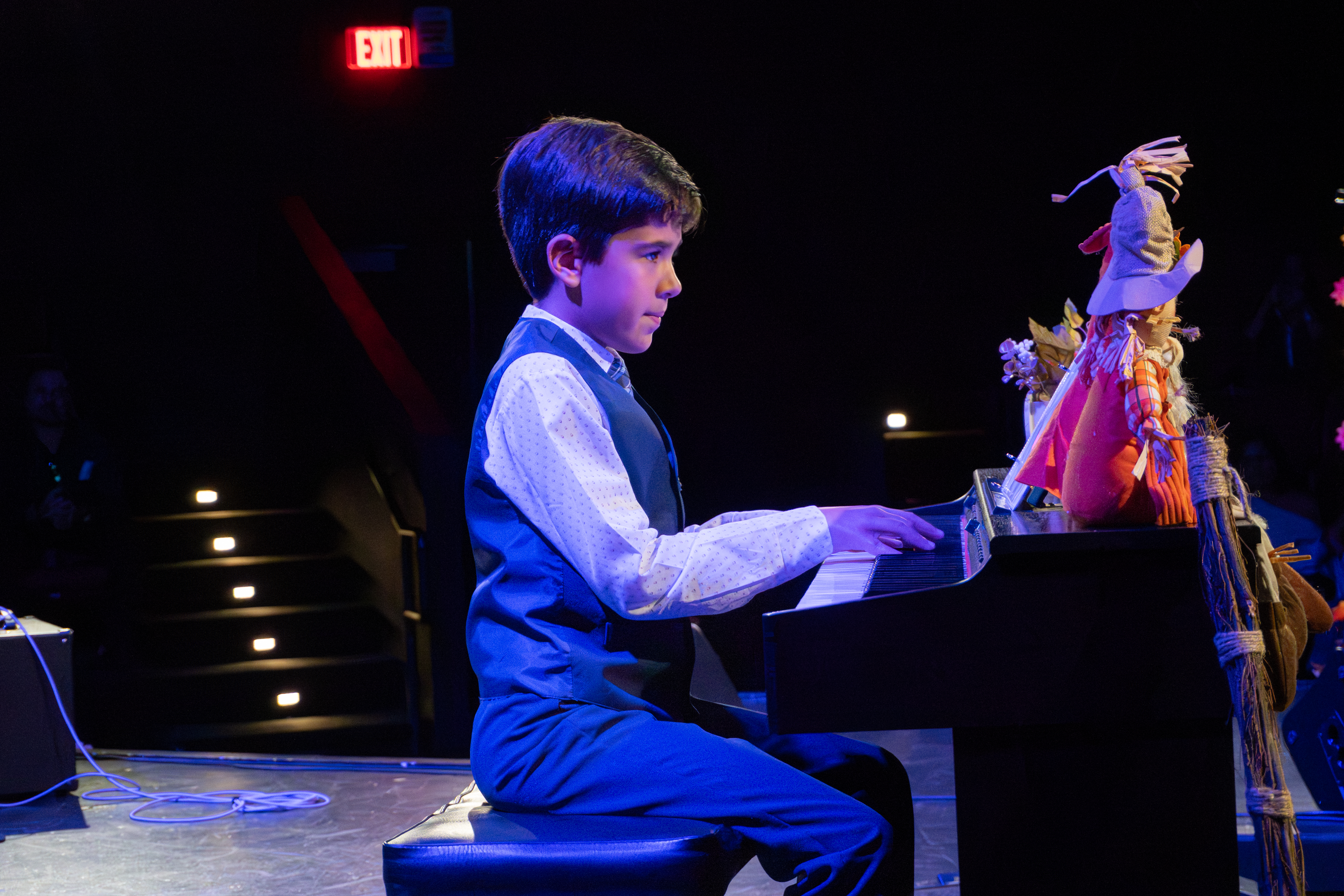 Young pianist performing on stage