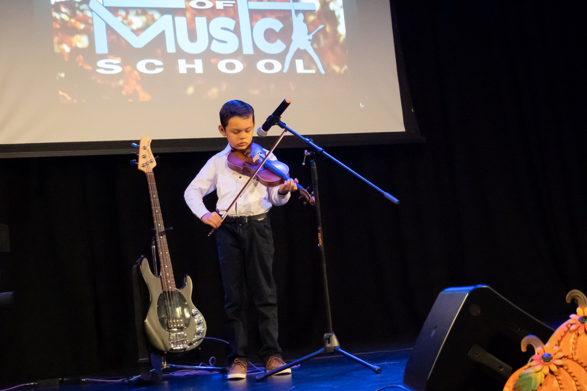 Young violinist on stage